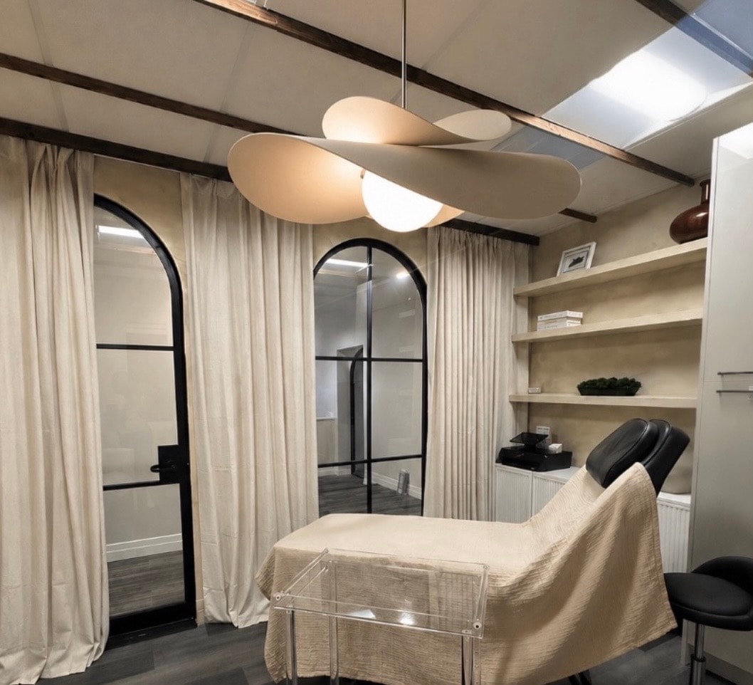 The Essence treatment suite — warm, minimal, and serene